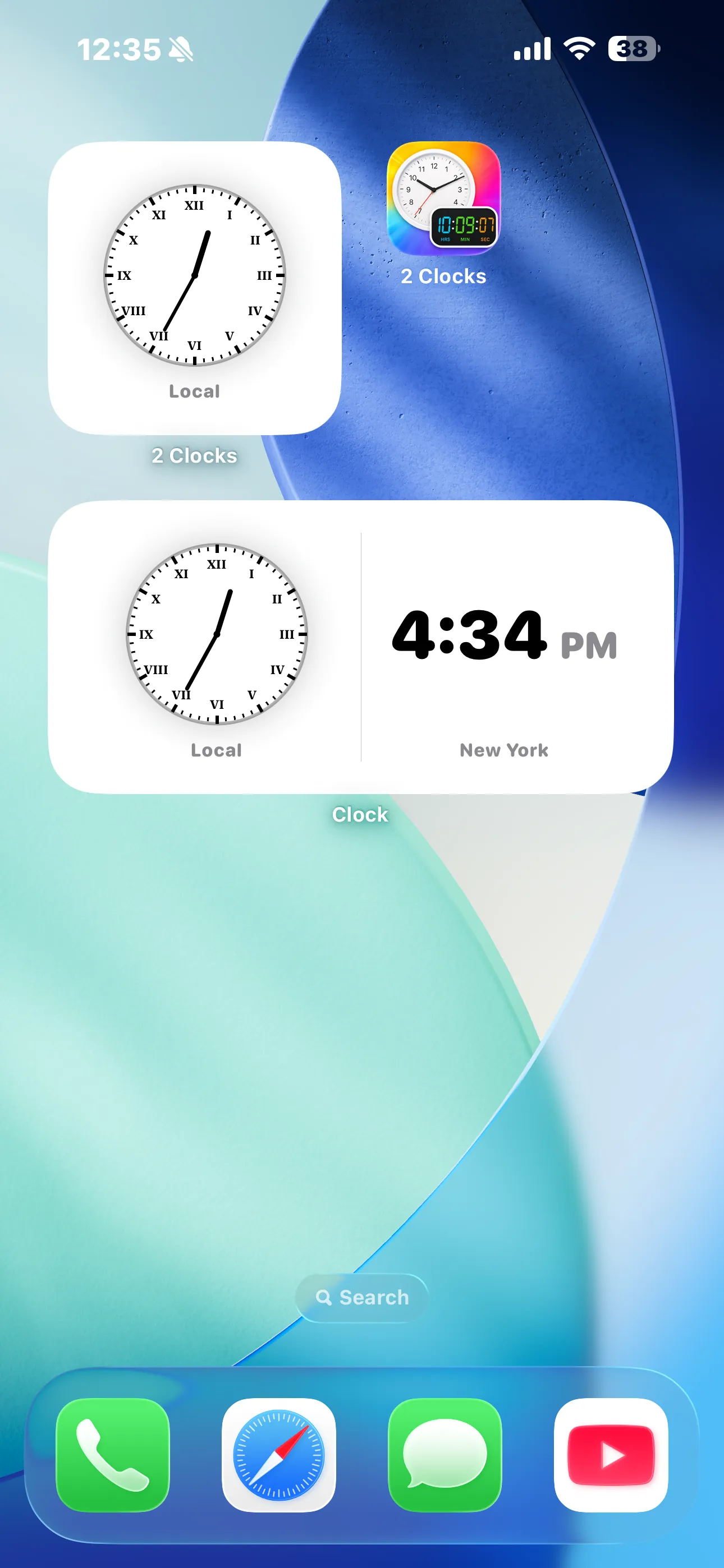 2 Clocks small and medium widgets on iPhone Home Screen showing Local and New York times